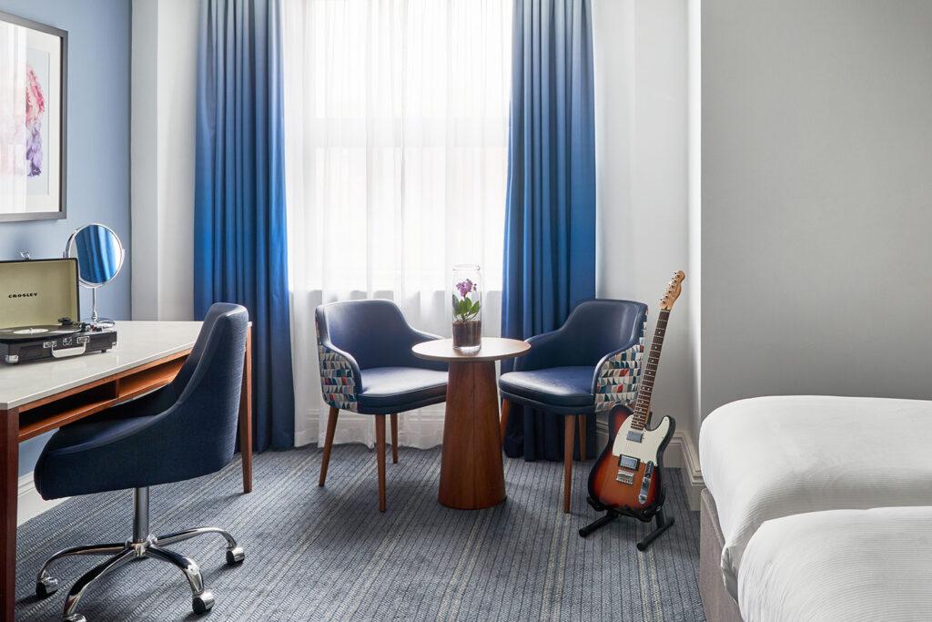 Seat and Guitar at the Executive King Room - The Cumberland
