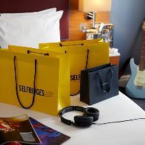 Shopping bags on a bed