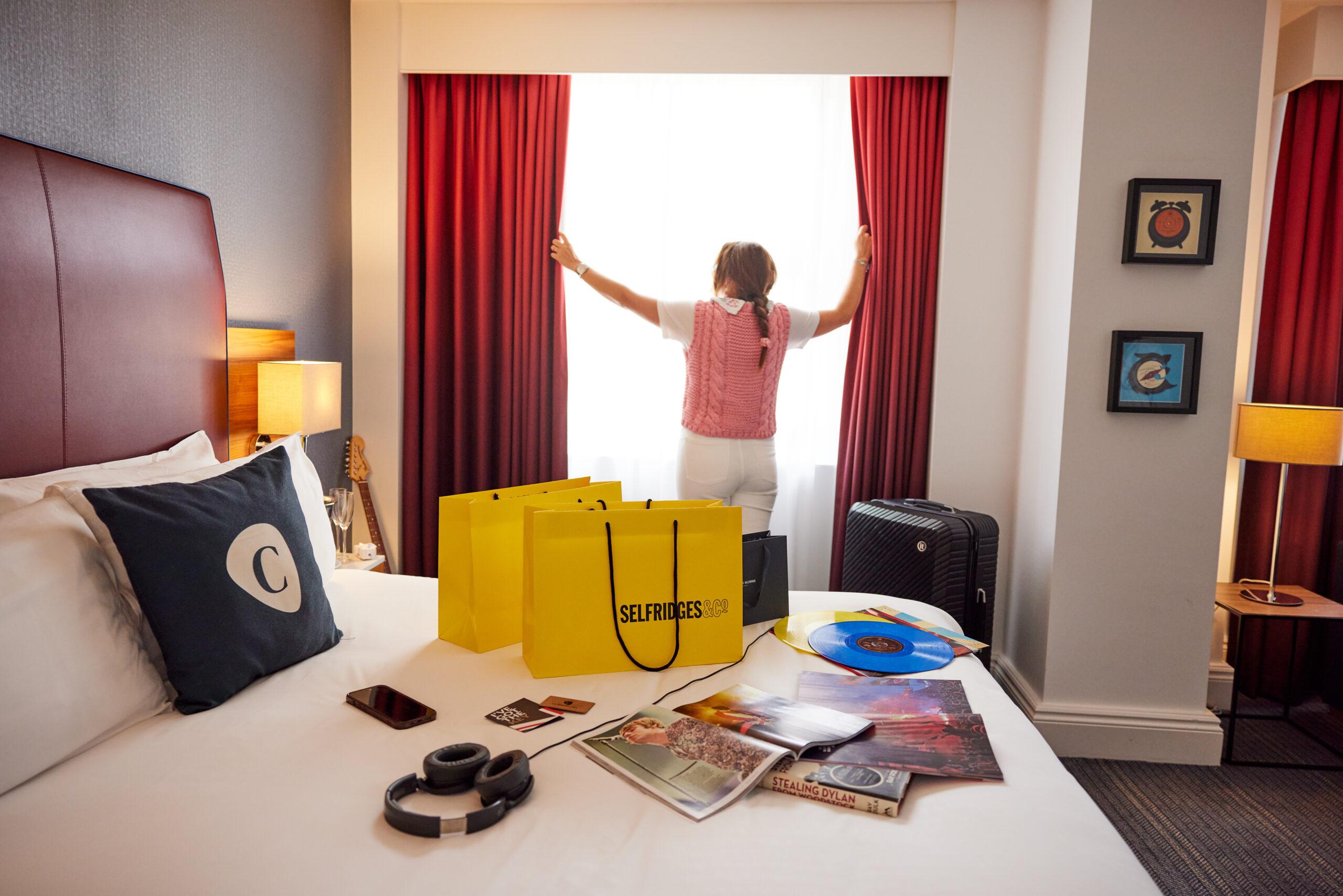 Selfridges bags on bed at Cumberland hotel