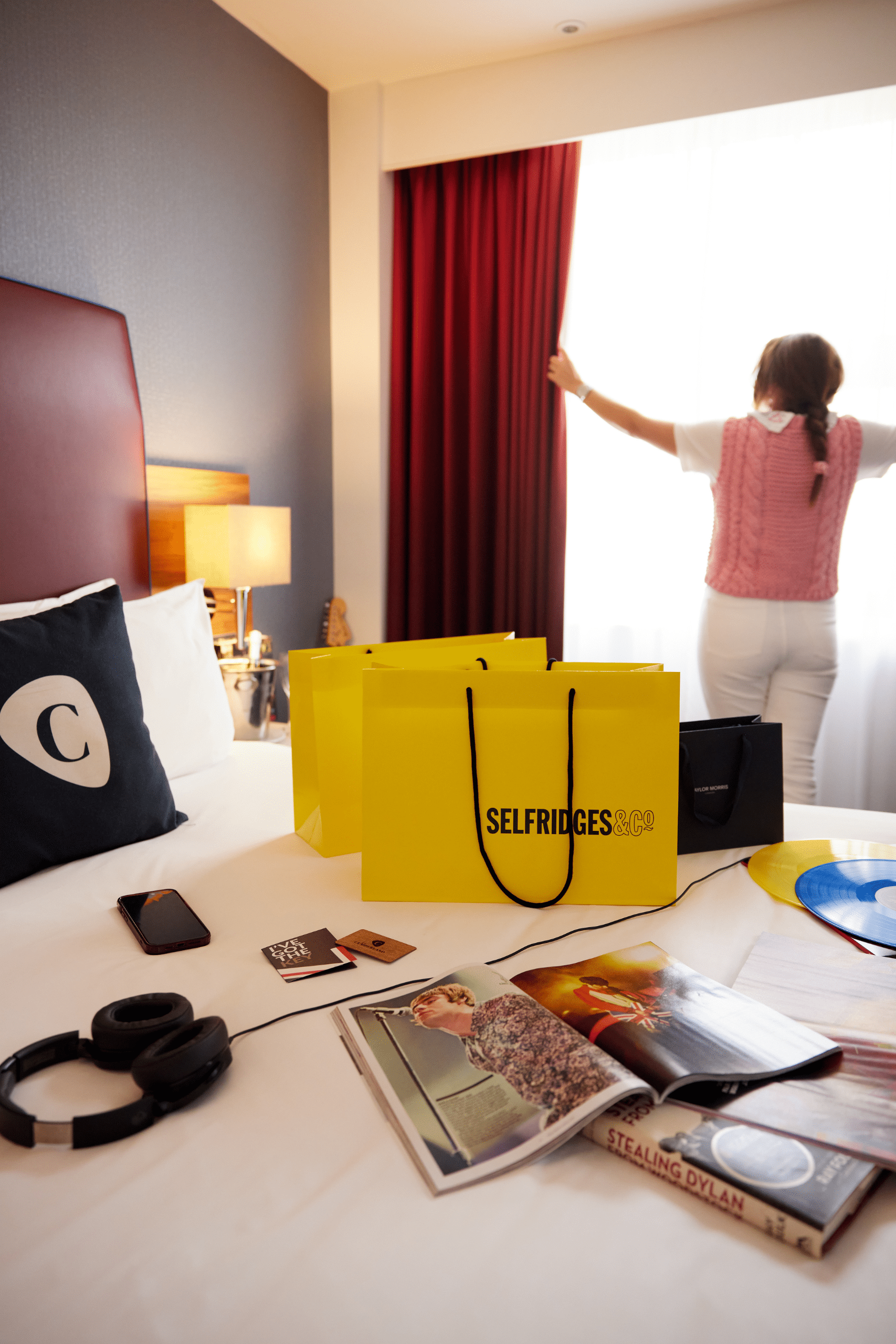 Selfridges bags on bed in Cumberland hotel