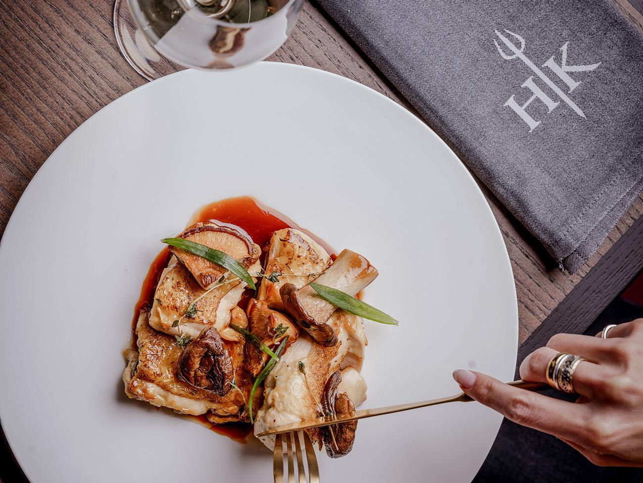 Close up of a delicious plate of food with a Hell's Kitchen Branded Serviette